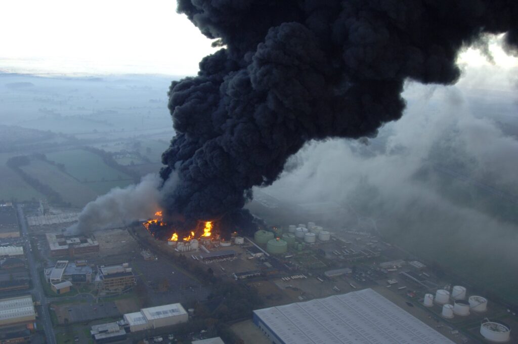 Smoke development after fire in oil storage depot, United Kingdom